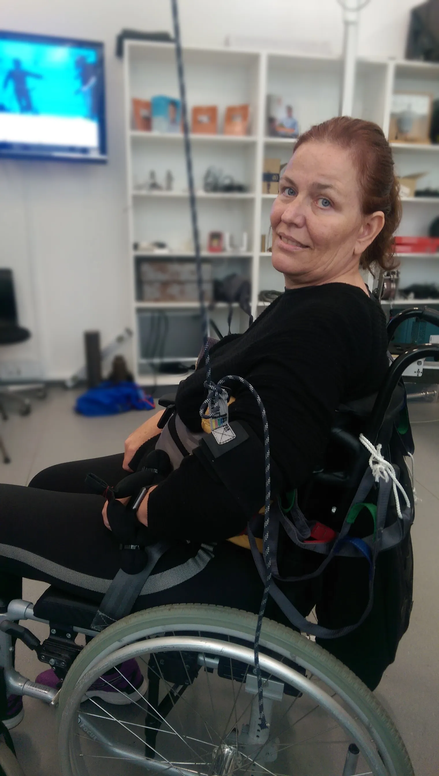 Tina seated in her wheelchair at a rehabilitation centre